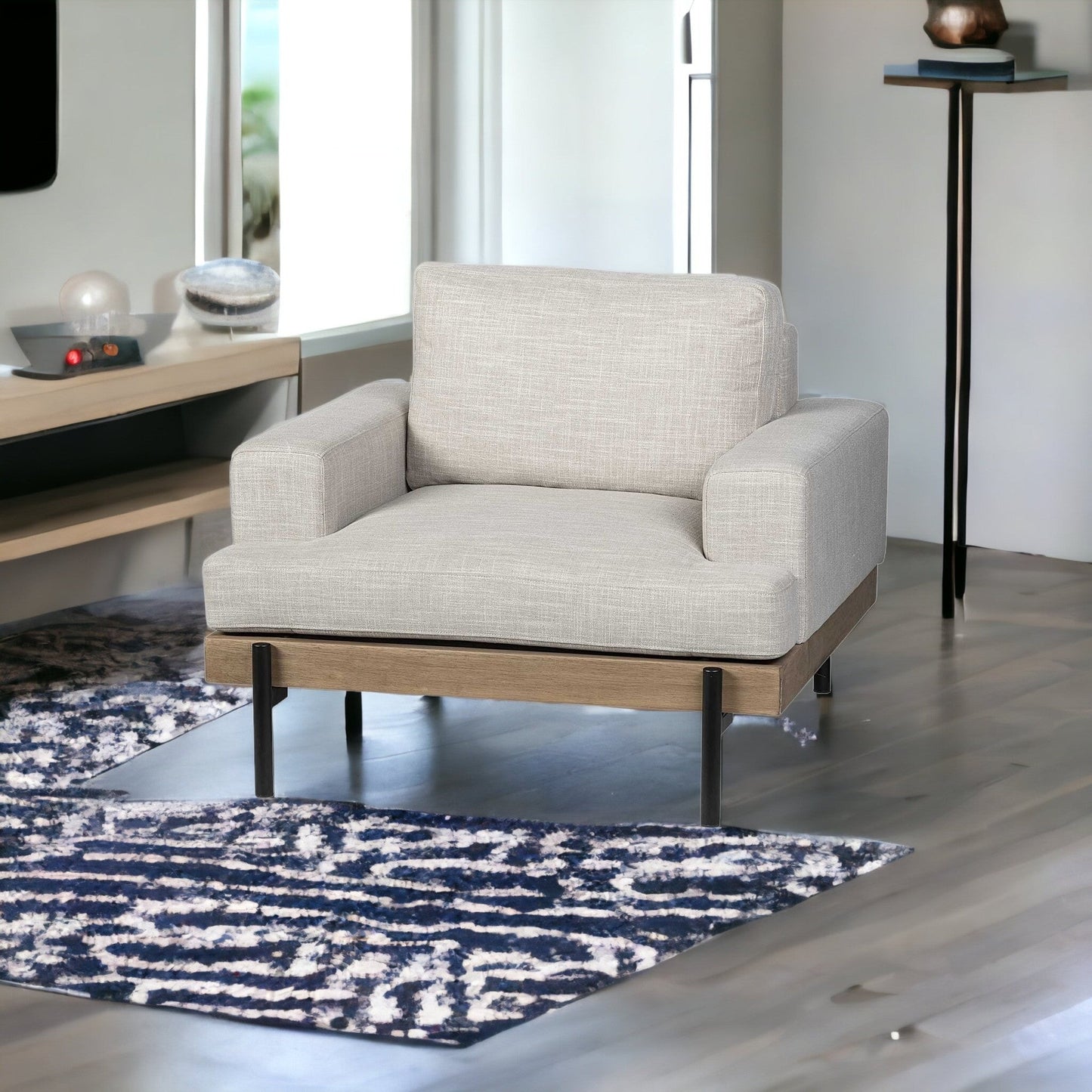 41" cream and black fabric arm chair with solid wood frame and removable cushions.