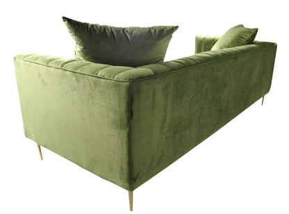 90" olive green velvet sofa with gold legs and toss pillows.