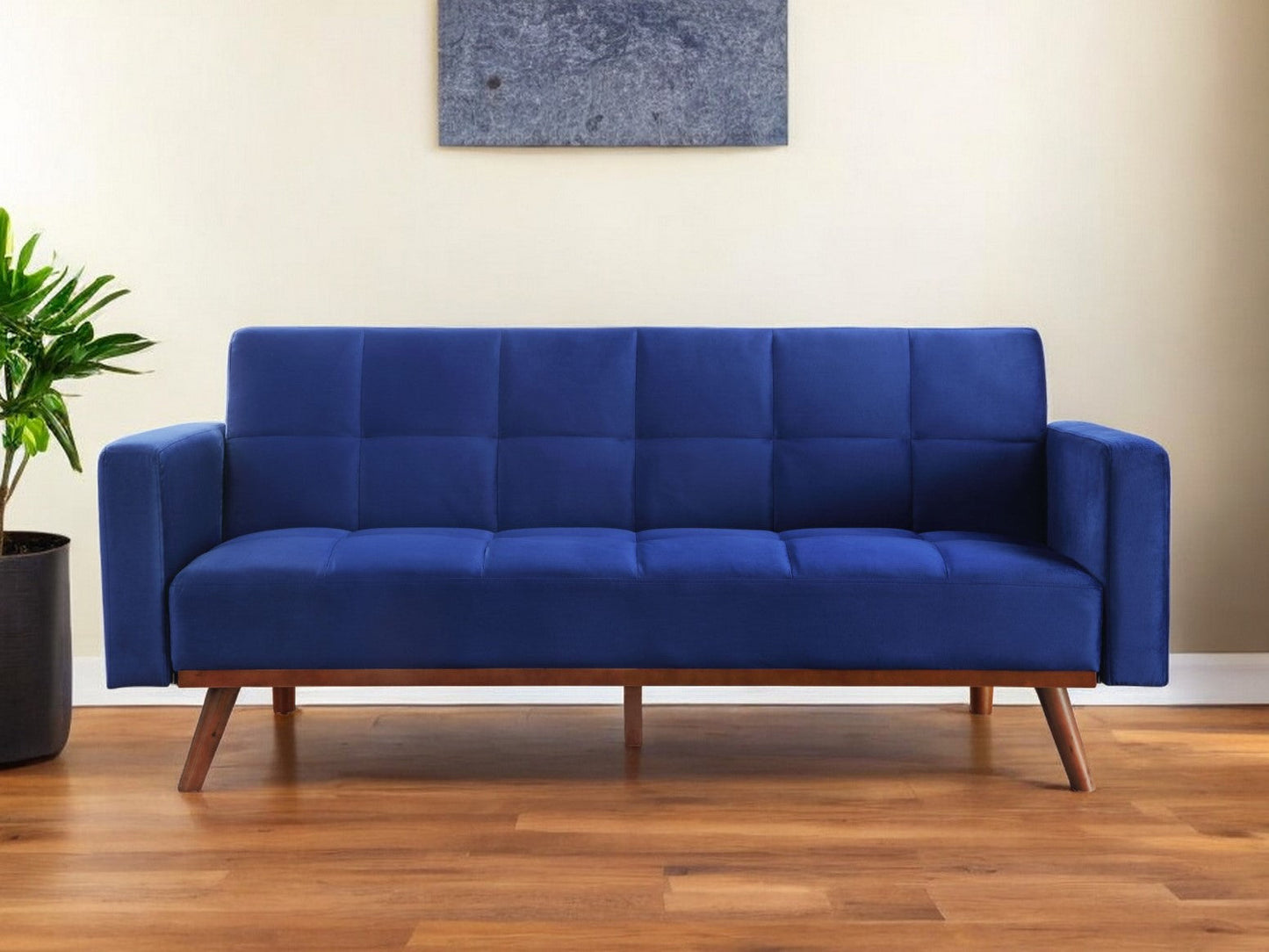 76" blue velvet futon sleeper sofa with brown legs in a modern living room setting.