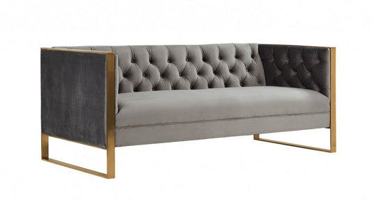 75" gray velvet sofa with gold legs, tufted design, modern style.