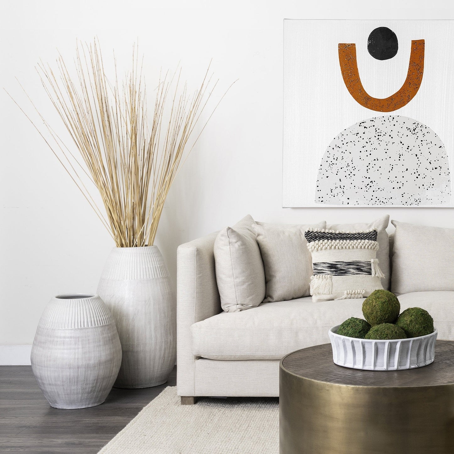 White Embossed Stripes Ceramic Vase in modern living room, featuring a tall, narrow design with textured stripes.