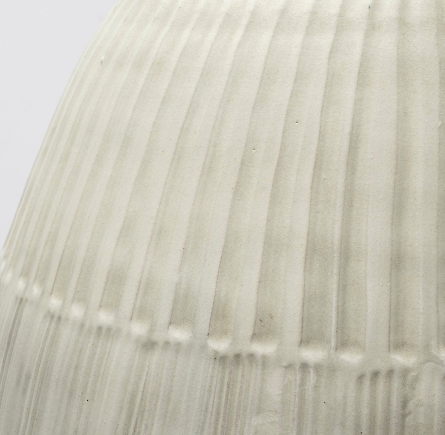 White Embossed Stripes Ceramic Vase with glazed matte finish and striped pattern.