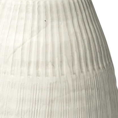 White embossed stripes ceramic vase with embossed pattern and matte finish.