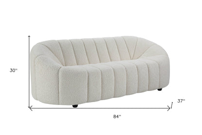 84" white sherpa sofa with black legs, modern design, armless, 3-seater, cozy upholstery.