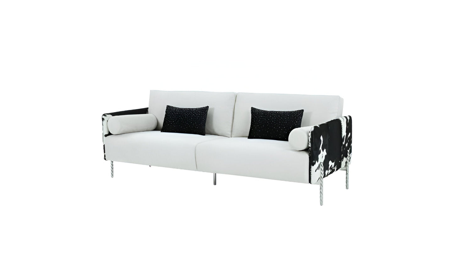 89" white sofa with silver legs and black toss pillows.