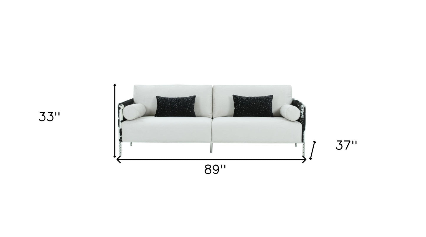 89" white sofa with toss pillows and silver legs, featuring track arms and durable polyester fabric.