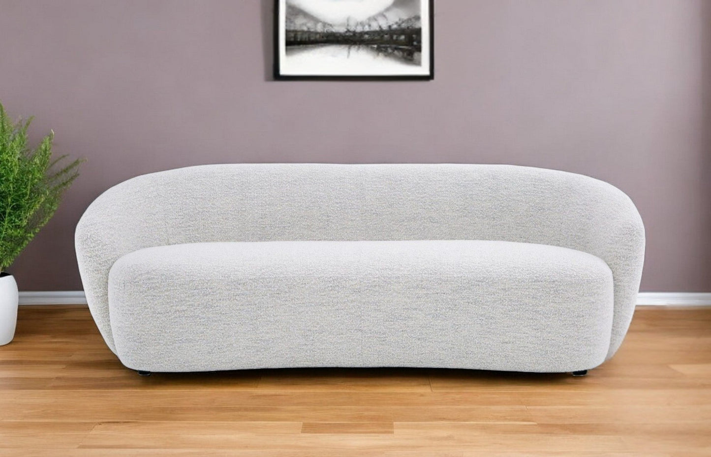 90" off-white fabric sofa with black metal legs, round arms, and sleek design.